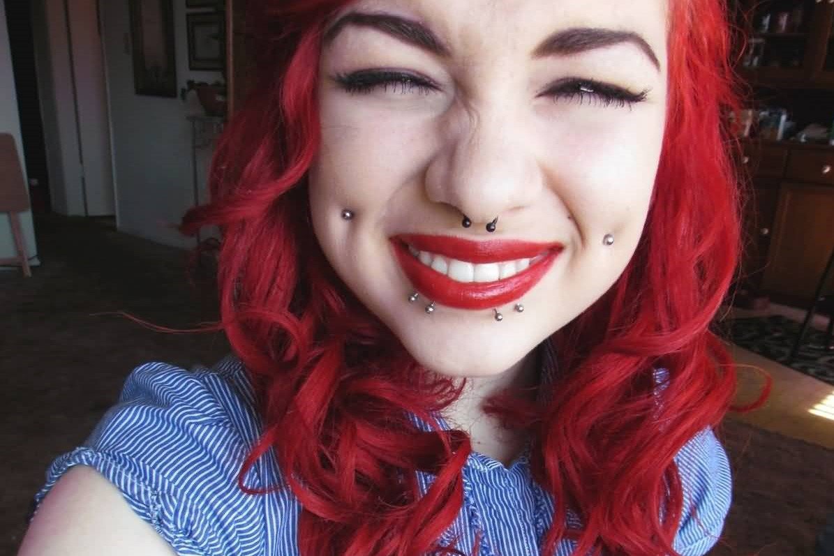 Beautiful-Smiling-Girl-With-Cheek-Piercings.jpg