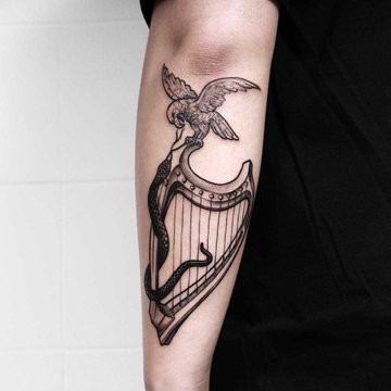 Hawk-snake-and-harp-done-at-High-Tension-Tattoo.jpeg