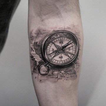 Realistic-Compass-Tattoo-On-Man-Left-Forearm.jpg