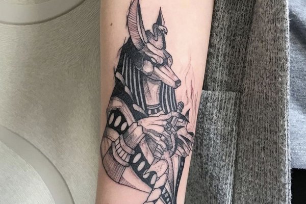 arm-anubis-tattoo-women-water.jpg